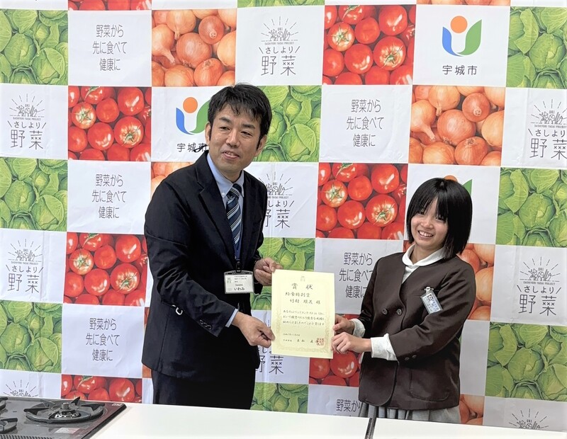 表彰されている竹村さんの写真
